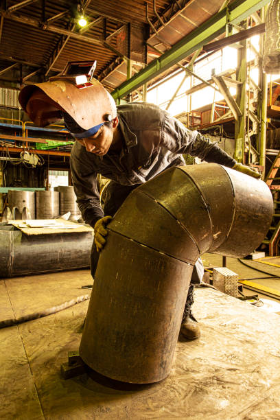 istock Japanese man working at the iron factory. 1168324838