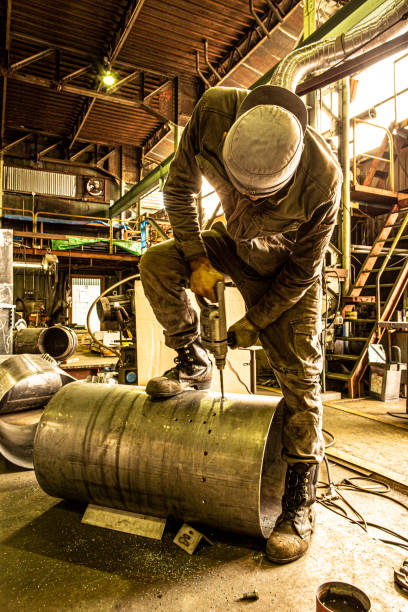 istock Japanese man working at the iron factory. 1168324982