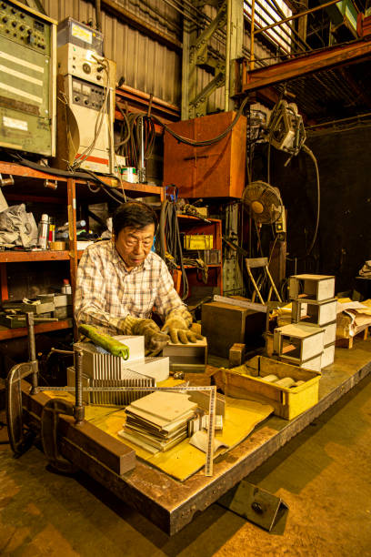 istock Japanese man working at the iron factory. 1168325072