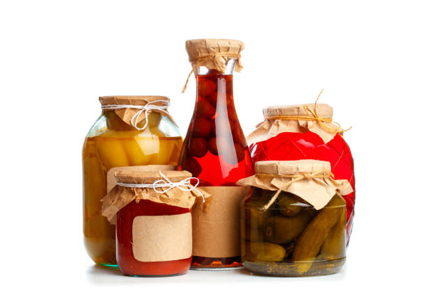set og  glass bottles with preserved food on white background - Image
