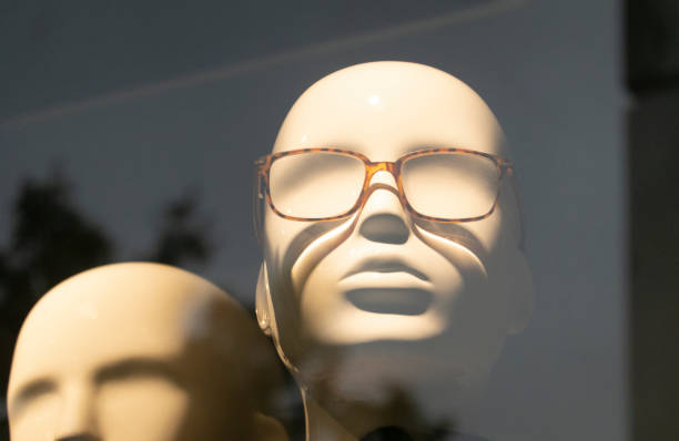 mannequin looks through window
