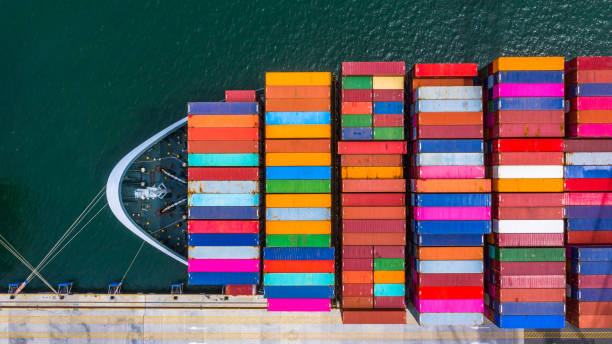 istock Container ship loading and unloading in deep sea port, Aerial top view of business logistic import and  export freight  transportation by container ship in open sea. 1168336177