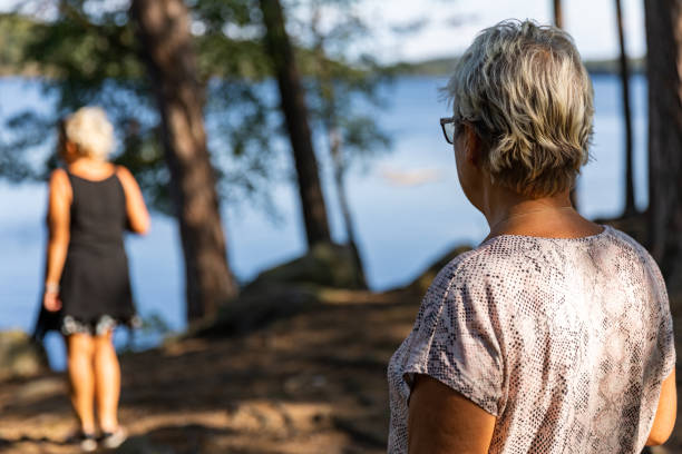 istock Senior ladies walking in a forest 1168336381