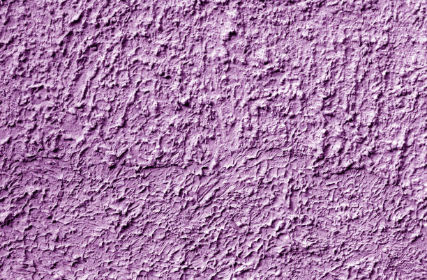 istock Grungy cement wall texture in purple tone. 1168338740