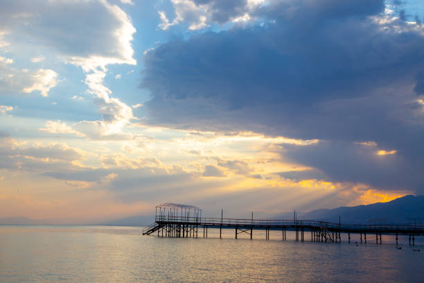 istock sky sunset sea. Beautiful clouds, soft colors. Natural background 1168342699
