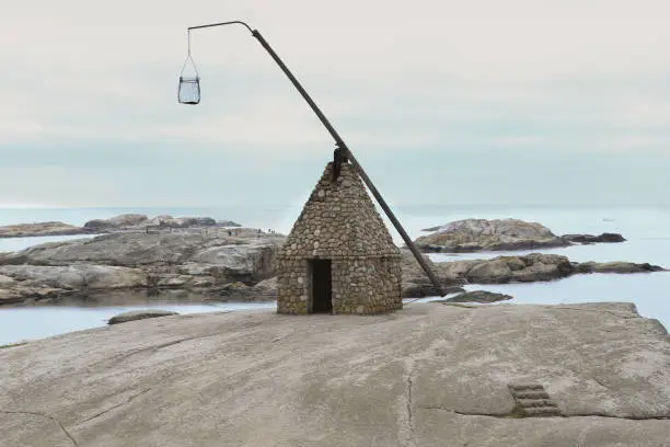 Photo of Lighthouse made by stones  at The End of the Earth on Tjome in Norway.
