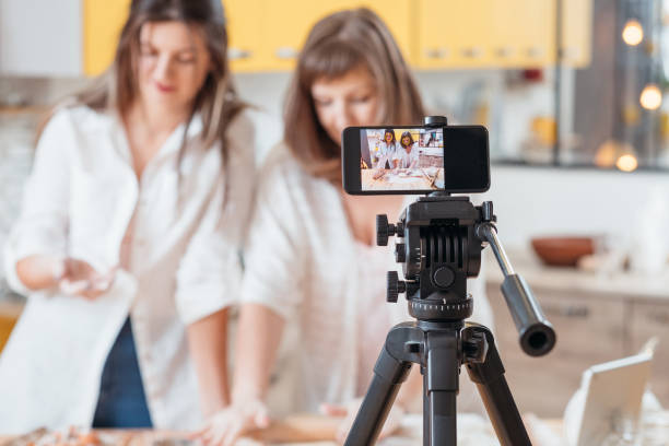 istock culinary vlog women baking smartphone online hobby 1168347652