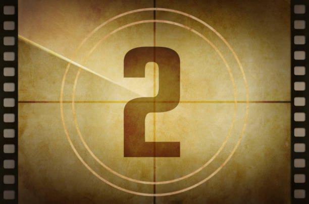 Vintage old film projector countdown screen with the number 2 at the center.