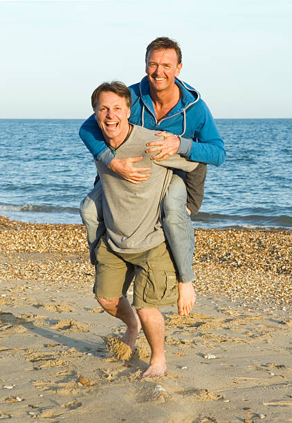 A couple having fun on the beach stock photo