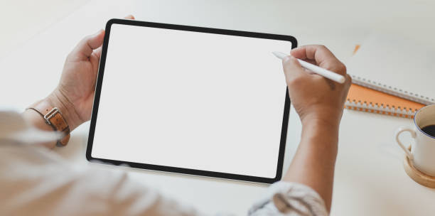 istock Cropped view of man using blank screen tablet in modern 1168351518