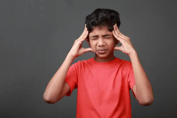 Photo of Boy with a painful face expression