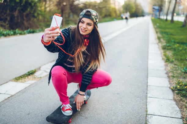 istock Skater girl making selfies 1168355068
