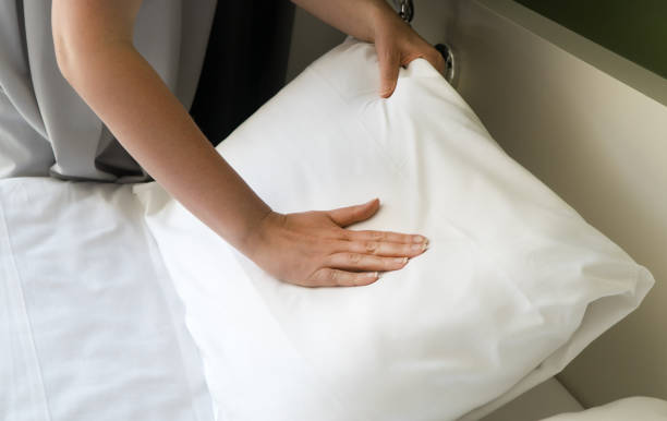 istock Room service. Woman making bed in hotel room. 1168356841