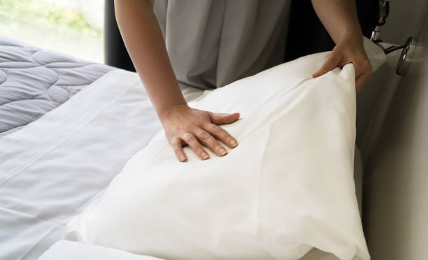 istock Room service. Woman making bed in hotel room. 1168356846