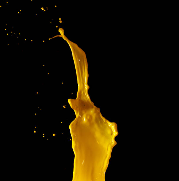 istock Yellow paint splash isolated on black background 1168358106