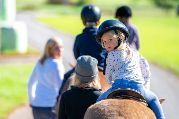 istock Children training horseback riding 1168358783