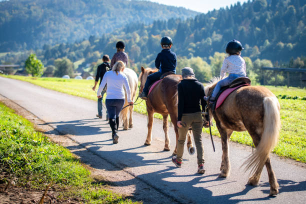 istock Children training horseback riding 1168358790