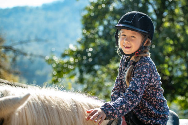 istock Girl sitting on horse 1168358794