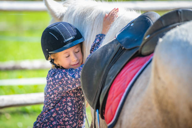 istock Girl leaning on horse 1168358798