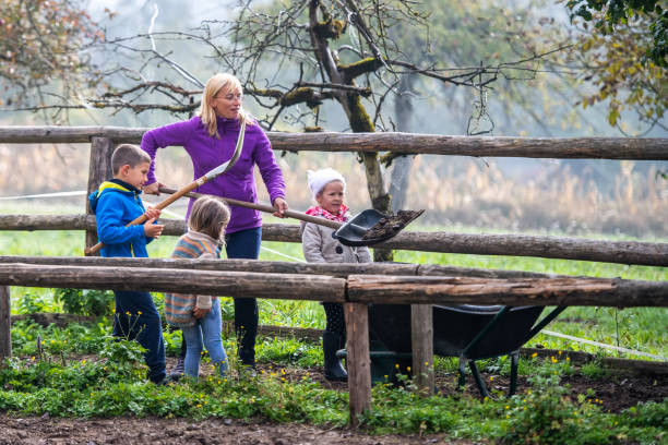 istock Woman and children working on ranch 1168358809