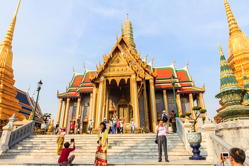 Bangkok, Thailand - 30th November 2014: Chinese tourists swarm over the Grand Palace. The Palace is the foremost tourist attraction in Bangkok.