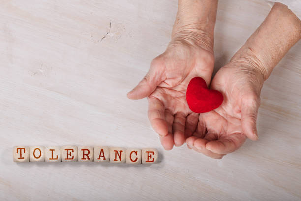 istock Word TOLERANCE composed of wooden dices. 1168359989