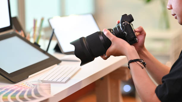 istock Photographer man working with professional camera. 1168363924