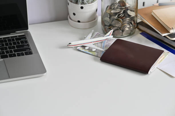istock Travel preparations concept, Passport, airplane ticket and map on office table. 1168364111