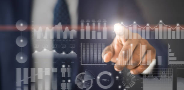 istock Businessman choosing one annual data diagram among others 1168364221