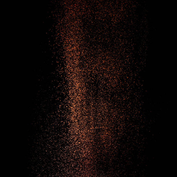 cocoa powder sifting isolated on black background. chocolate dust on black background - sifting imagens e fotografias de stock