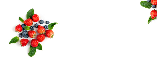 istock Fresh berries on white background, top view. Strawberry, blueberry and mint leaf, flat lay. Summer background. Long format 1168366460