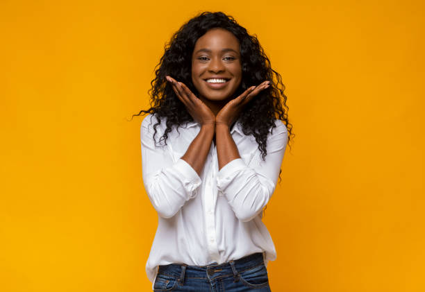 istock Cute african american girl touching her cheeks 1168366660