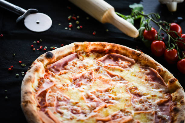 istock tasty italian pizza with prosciutto & cheese 1168366858