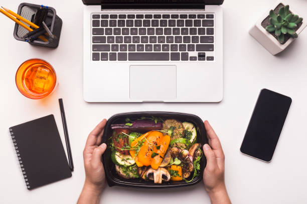 istock Grilled vegetables in take away box in woman hands for dinner 1168368333