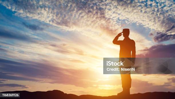 Soldier Saluting At Sunset Army Salute Patriotic Concept Stock Photo - Download Image Now