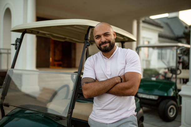 The golf car driver is proud of his work stock photo