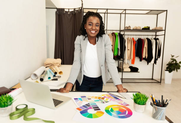 istock Cheerful Black Fashion Designer Smiling Working In Studio 1168371474