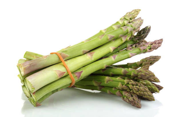 istock Bunch of green asparagus isolated on white 1168371761