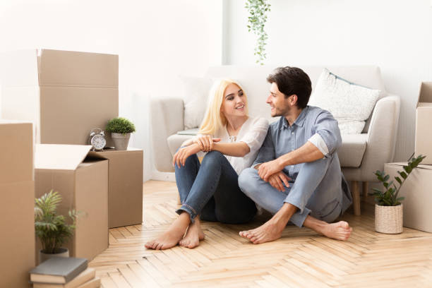 istock Beautiful Couple Discussing Future Plans After Moving Into New Flat 1168371783