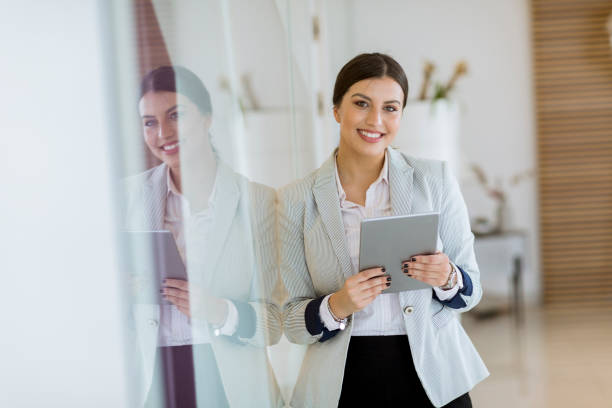 istock Young woman with a tablet in the office 1168371832