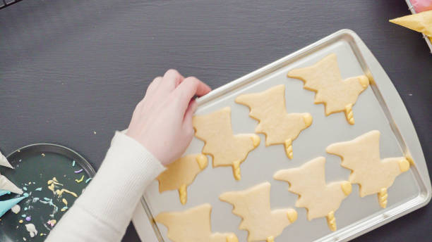 istock Decorating unicorn sugar cookies with multi-color royal icing. 1168372493