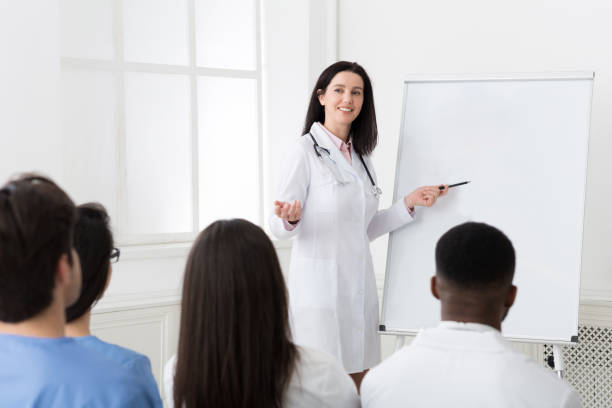 istock Successful doctor sharing experience with colleagues in hospital 1168372869