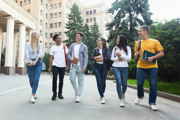 istock Diverse students walking outside the college building 1168372875