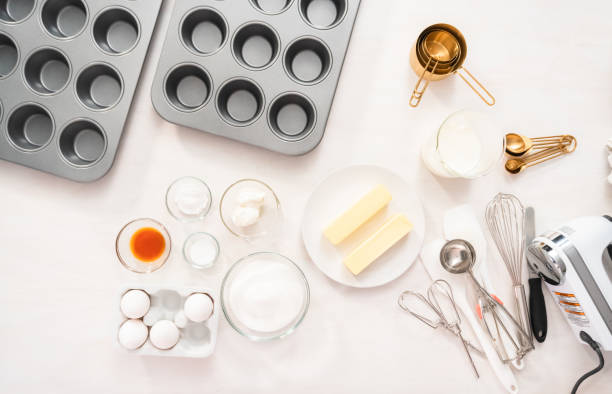 istock Mixing batter to bake home made vanilla cupcakes. 1168373094