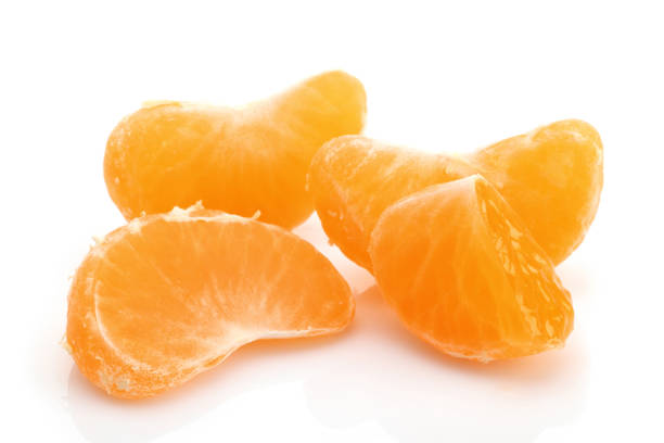 istock Fresh peeled tangerine slices isolated on white 1168374467