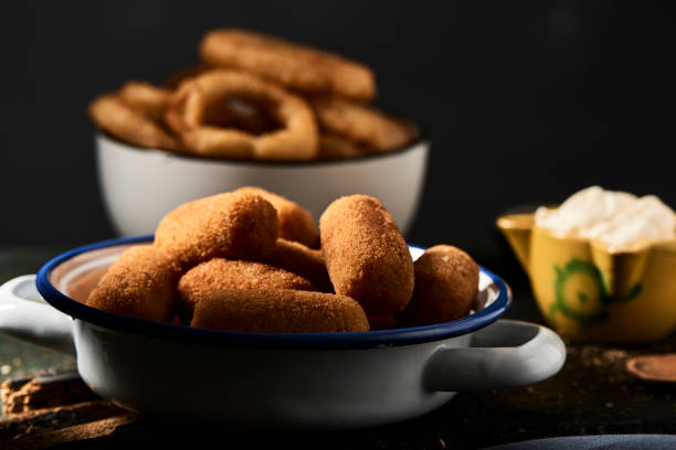istock spanish croquettes and fried squid rings 1168374724