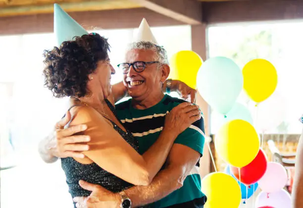 Senior couple together celebrating a birthday party