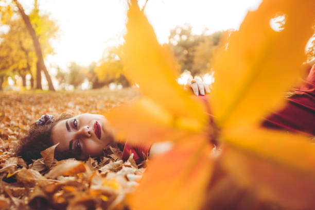 istock Lying on autumn leaves 1168380098