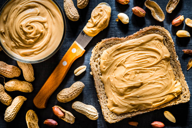 istock Peanut butter scattered on a slice of bread 1168380236