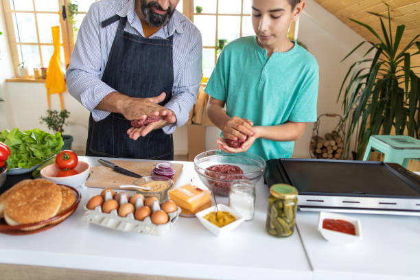 istock Father and son preparing ingredients for burgers 1168380956